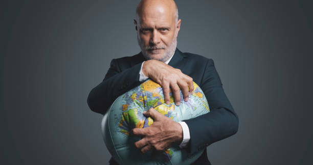istock Greedy corporate businessman crushing and exploiting earth 1444210837