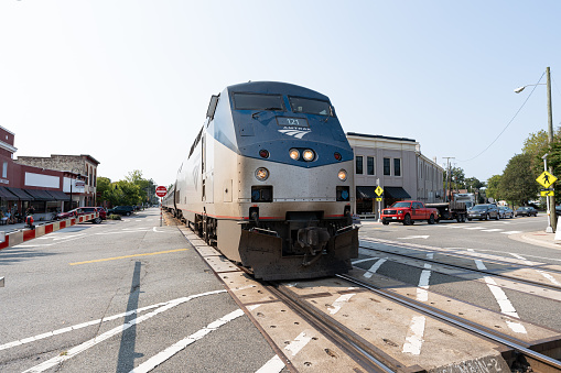 An Amtrak train rolling through downtown Ashland Virginia.