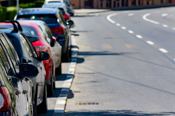 istock Cars parked in a row 1444211048