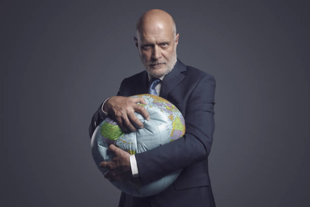 istock Greedy corporate businessman crushing and exploiting earth 1444211106