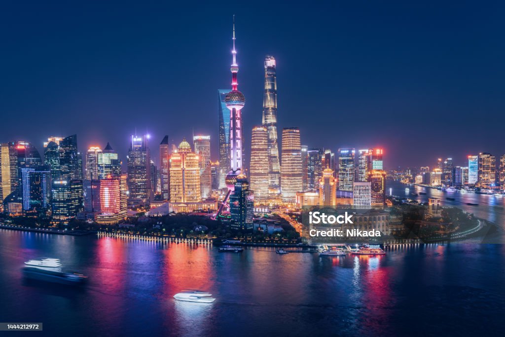 Aerial skyline view of Shanghai at dusk Aerial skyline view of Shanghai at dusk showing the financial district of Pudong and its tall skyscrapers. China - East Asia Stock Photo