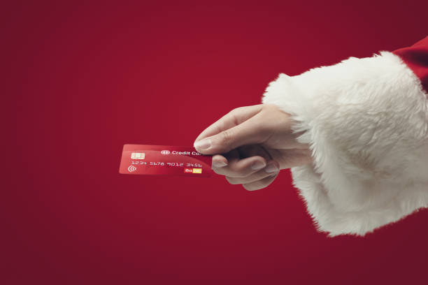 istock Santa Claus paying with a credit card 1444213106