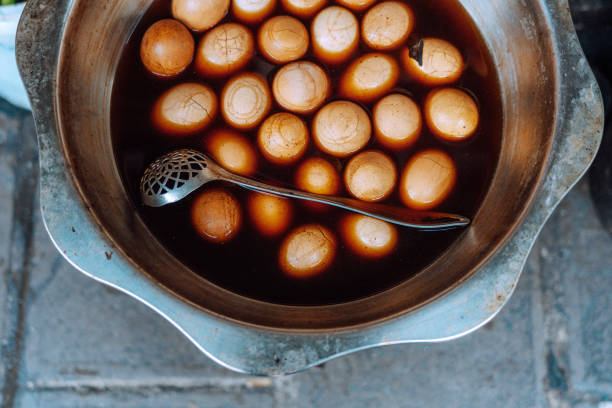 chinese street food stall with various types of boiled eggs