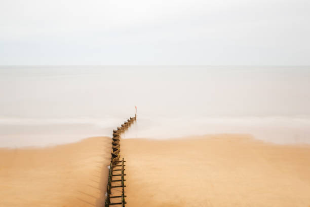 istock Zig zag sea groyne and soft wave movement. Overstrand Norfolk 1444217663