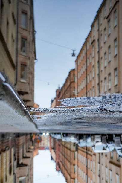 istock Upside down close-up of puddle in a city 1444228935