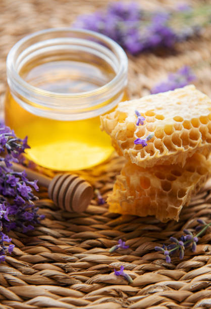 istock Jar with honey and fresh lavender flowers 1444230528