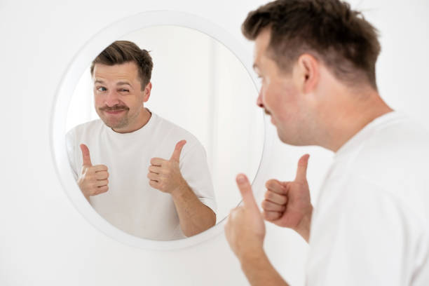 istock young man trying to cheer himself up before a first date 1444233394