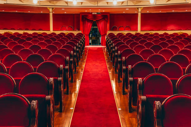 Theater stalls. Red carpet path to the exit.