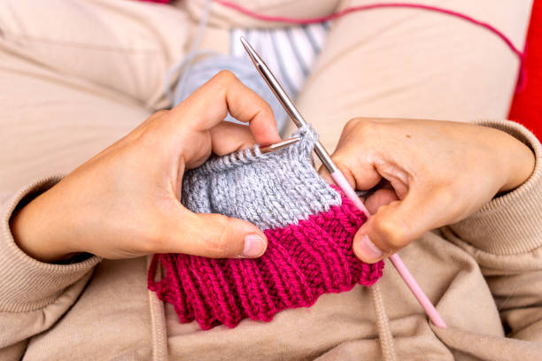 istock Close-up of a woman's hands knitting with needles. 1444234933