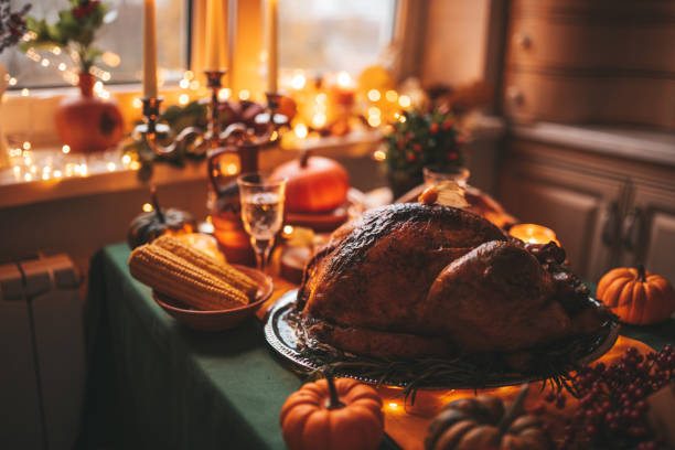 istock Thanksgiving holiday dinner table setting with fall decoration and pumpkins 1444237571