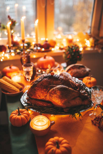 istock Thanksgiving holiday dinner table setting with fall decoration and pumpkins 1444237578