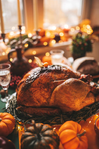 istock Thanksgiving holiday dinner table setting with fall decoration and pumpkins 1444237579