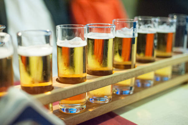 istock Long row of beer in tall glasses.. 1444238242