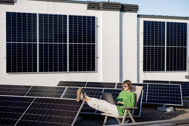 istock Woman works on a rooftop with a solar station 1444244509