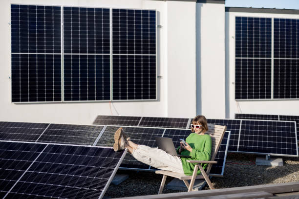 istock Woman works on a rooftop with a solar station 1444244542