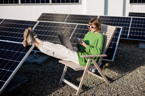 istock Woman works on a rooftop with a solar station 1444244587
