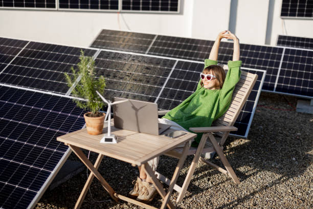 istock Woman works on a rooftop with a solar power plant 1444244659