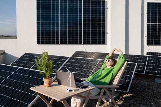 istock Woman works on a rooftop with a solar power plant 1444245313