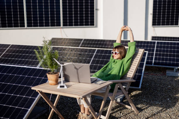 istock Woman works on a rooftop with a solar power plant 1444245401