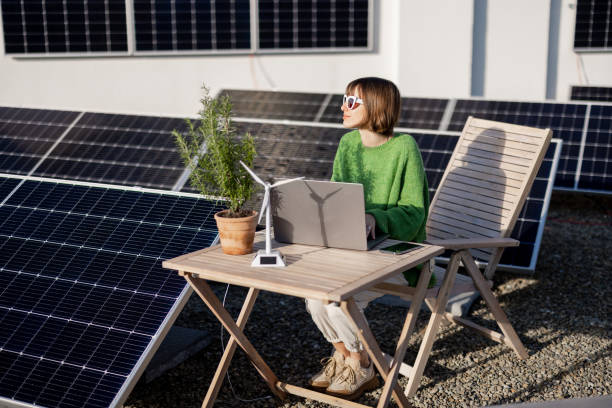 istock Woman works on a rooftop with a solar power plant 1444245457