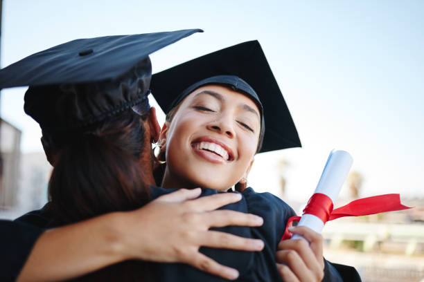 istock Education, graduation and success with students and hug with certificate for celebration, vision or happy after university. Scholarship, friends or support with girl graduate and college diploma 1444245780