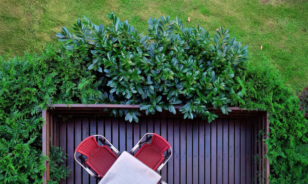 istock Terrace with red table and chairs. Drone view. 1444246202