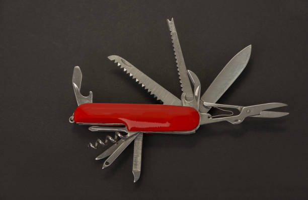 istock Open swiss army knife on a black background 1444248020