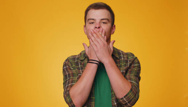 istock Frightened scared young man closing his mouth gestures no, refusing to tell terrible secret, truth 1444248061