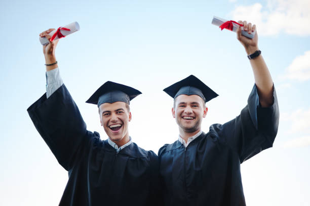 istock Graduate, success and students in graduation with future secured by education, knowledge and university certificate. Smile, portrait and happy men in celebration of college diploma at school academy 1444248706