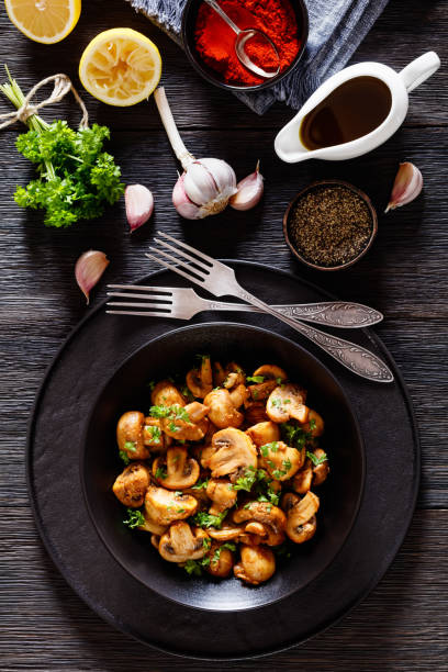 istock Spanish Garlic Mushrooms in bowl, top view 1444257754