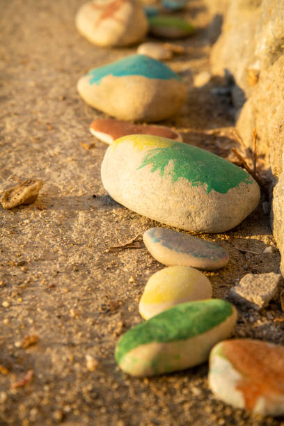 istock Painted stones stand in a row 1444260483
