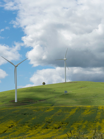 Wind turbine on a green hill with farmland near Ballarat