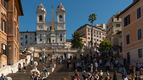 Rome, Italy - June 13 2019: Spanish Steps and Piazza di Spagna with Fontana della Barcaccia in foreground.