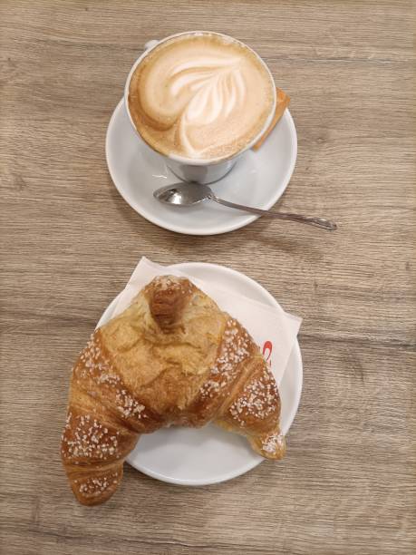 istock Breakfast with croissant and cappuccino 1444264113