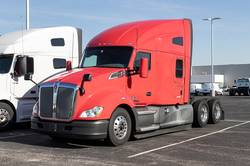 Indianapolis - Circa November 2022: Kenworth Semi Tractor Trailer Trucks on display at a dealership. Kenworth is owned by PACCAR.