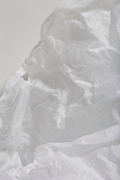 istock crumpled piece of paper against a harsh light white background 1444268331