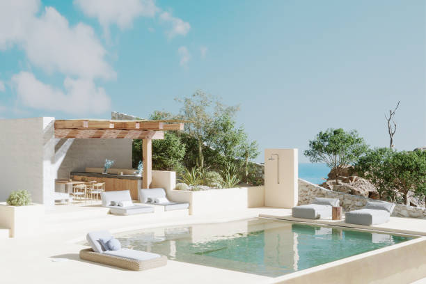 современный пляжный отель с бассейном с видом на море - swimming pool infinity pool patio sea стоковые фото и изображения