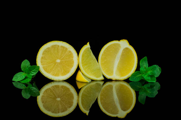 istock Still life, lemon and lime on black background 1444272939