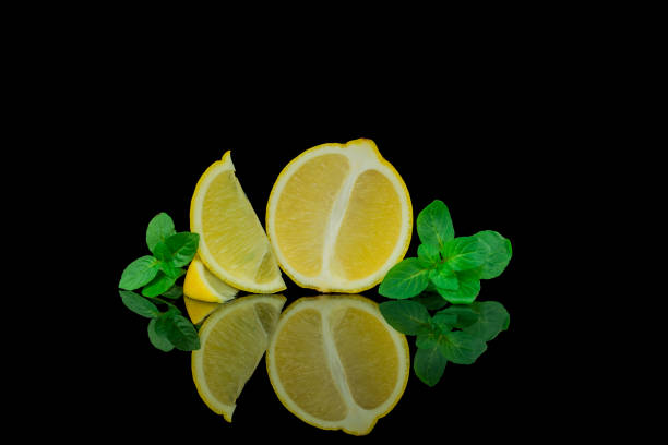 istock Still life, lemon and lime on black background 1444272987