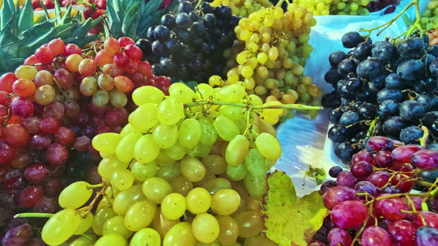 Grape Bunch of Different Colors on the Market Counter