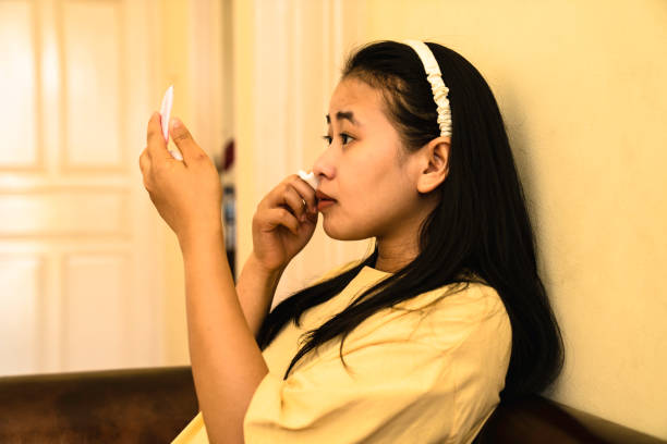 istock Woman cleaning her face 1444280078