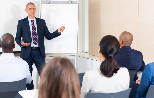 istock Businessman presenting business project to his team members 1444283033