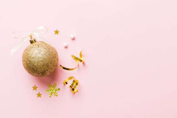 istock Christmas ball on colored background. decoration bauble with ribbon bow with copy space 1444283072