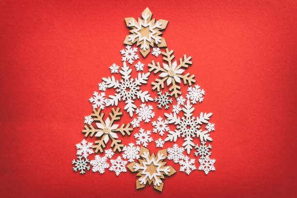 istock Christmas tree made from colored handmade ball decoration on colored background, view from above. New Year minimal concept with copy space 1444283187