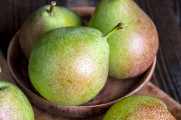 istock Whole ripe green pears, close up 1444284878