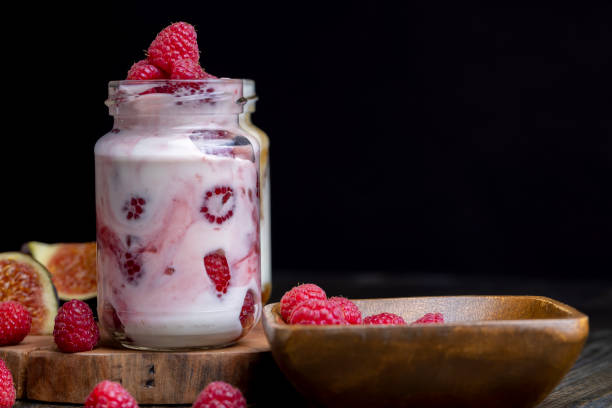 istock Milk yogurt with raspberries, close up 1444285114