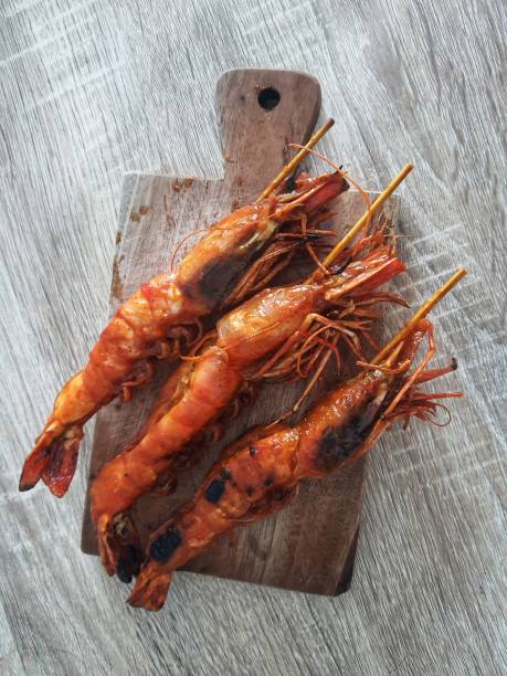 Honey spiced grilled prawns, a typical Indonesian seafood dish that has a savory and sweet taste that is perfectly balanced stock photo