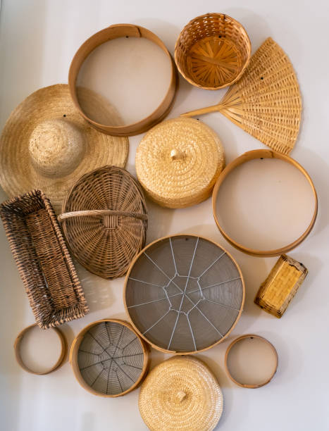 istock Handicraft handmade from natural products, wicker basket bamboo fan straw hat 1444290330