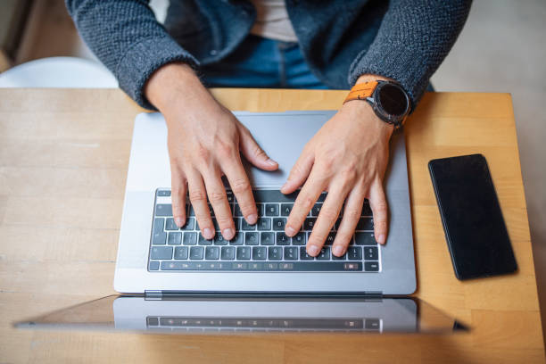 istock Shot from above of unrecognizable businessman using laptop for work. 1444291560
