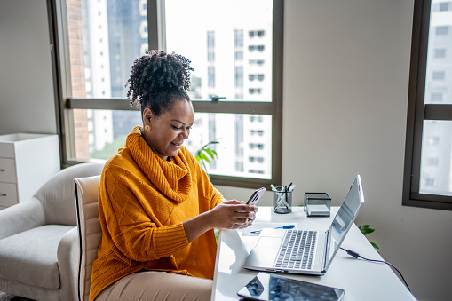 Black woman working from home office